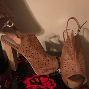 Ladies wooden high heel sandal.